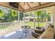 Relaxing screened porch with views of the landscaped backyard and additional outbuildings at 1268 Harris Road Rd, Lawrenceville, GA 30043