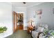 Sitting room features a chair, table, lamp and view of the staircase at 1268 Harris Road Rd, Lawrenceville, GA 30043