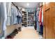 Walk-in closet is spacious with wooden shelves and ample clothing storage at 1268 Harris Road Rd, Lawrenceville, GA 30043