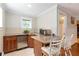 Charming wet bar area with granite countertops and stainless steel appliances at 1268 Harris Road Rd, Lawrenceville, GA 30043