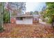 Home featuring a backyard with mature trees and partial fencing at 1410 Willow Dr, Riverdale, GA 30296