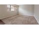 Spacious bedroom featuring neutral walls, carpeted floors, and a large window offering natural light at 1410 Willow Dr, Riverdale, GA 30296