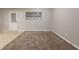A versatile room with plush carpet, a window, and a door to the backyard, suitable for various purposes at 1410 Willow Dr, Riverdale, GA 30296