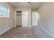 Room featuring a carpeted floor, closet, and a window for natural light at 1410 Willow Dr, Riverdale, GA 30296
