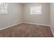 Neutral bedroom has a carpeted floor and a window for natural light at 1410 Willow Dr, Riverdale, GA 30296