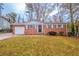 Charming brick home with a manicured lawn and a welcoming front entrance at 1410 Willow Dr, Riverdale, GA 30296