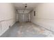 Clean, spacious garage with painted walls and a functional garage door at 1410 Willow Dr, Riverdale, GA 30296