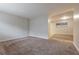 Large living room with new carpet and plenty of space for entertaining and relaxation at 1410 Willow Dr, Riverdale, GA 30296