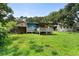 Expansive backyard with lush green grass and mature trees, ideal for outdoor activities at 1550 Bells Ferry Rd, Marietta, GA 30066
