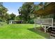 A backyard featuring a wooden deck, shed, and partial car port at 1550 Bells Ferry Rd, Marietta, GA 30066