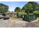 Front exterior of house with driveway, vehicles and construction dumpster at 1550 Bells Ferry Rd, Marietta, GA 30066