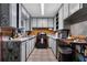A small kitchen with updated appliances and white cabinets at 1550 Bells Ferry Rd, Marietta, GA 30066