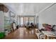 A living room featuring hardwood floors, decorative mirror, and white tile walls at 1550 Bells Ferry Rd, Marietta, GA 30066