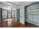 The living room has freshly painted blue walls, hardwood floors, and a ceiling fan at 1550 Bells Ferry Rd, Marietta, GA 30066