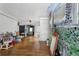 Open living room featuring hardwood floors, vintage-style ceiling fan, and decorative faux finish on wall at 1550 Bells Ferry Rd, Marietta, GA 30066