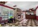 Cozy living room with stone fireplace, tile floors, and wet bar, needs some TLC at 1550 Bells Ferry Rd, Marietta, GA 30066