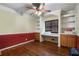 Office space featuring built-in shelves, cabinets, hardwood floors, and natural light at 1550 Bells Ferry Rd, Marietta, GA 30066