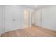 Neutrally painted bedroom featuring ample closet space and entry doors to additional rooms at 3052 Brook Dr, Decatur, GA 30033