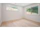 Minimalist bedroom with two large windows providing natural light and bright neutral paint at 3052 Brook Dr, Decatur, GA 30033