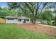 Beautifully landscaped house featuring a spacious front yard with vibrant plants at 3052 Brook Dr, Decatur, GA 30033
