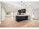 A modern kitchen features black cabinets, stainless steel appliances, and an island with a sink at 3052 Brook Dr, Decatur, GA 30033