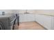 Well-organized laundry room with modern washer and dryer and ample cabinet space at 3052 Brook Dr, Decatur, GA 30033