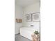Modern bathroom featuring a free-standing tub, black fixtures, and light-toned tiles at 3117 Robinson Ave, Scottdale, GA 30079