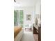 Bright bedroom featuring large windows offering an abundance of natural light and a calming color palette at 3117 Robinson Ave, Scottdale, GA 30079