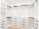 Walk-in closet featuring custom shelves, drawers, and rods for optimal storage solutions at 3117 Robinson Ave, Scottdale, GA 30079