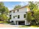 Home displaying a modern garage and a well-kept yard at 3117 Robinson Ave, Scottdale, GA 30079