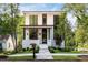 Charming modern home with landscaped front yard, updated siding, and stylish entrance at 3117 Robinson Ave, Scottdale, GA 30079