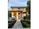 Contemporary home displaying a modern facade with a covered porch and manicured landscaping at 3117 Robinson Ave, Scottdale, GA 30079