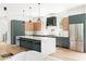 Spacious kitchen with a large island, modern appliances, and sleek cabinetry, blending style and functionality at 3117 Robinson Ave, Scottdale, GA 30079