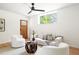 Bright living room with contemporary furniture, light hardwood floors, and large window at 3117 Robinson Ave, Scottdale, GA 30079