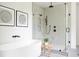 Contemporary bathroom with a frameless shower, rain showerhead, and white walls at 3117 Robinson Ave, Scottdale, GA 30079