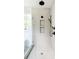 Modern shower with frameless glass door, rain showerhead, and built-in shower niche at 3117 Robinson Ave, Scottdale, GA 30079