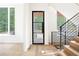 Modern staircase with wood steps and metal railings at 3117 Robinson Ave, Scottdale, GA 30079
