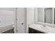 Featuring a bathroom with white tub, white toilet, and a dark wood vanity with a white countertop at 7099 Skippingstone Way, Douglasville, GA 30134