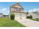 Beautiful two-story home with two-car garage and manicured landscaping at 7099 Skippingstone Way, Douglasville, GA 30134