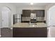 Modern kitchen with stainless steel appliances, granite countertops and center island at 7099 Skippingstone Way, Douglasville, GA 30134