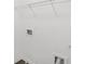 An unfinished laundry room with white walls, wire shelving, and hookups for a washer and dryer at 7099 Skippingstone Way, Douglasville, GA 30134