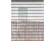 Detail of a window with horizontal blinds, showing light coming through the window at 7099 Skippingstone Way, Douglasville, GA 30134