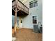 View of backyard with wooden deck, door, air conditioning unit and gray siding at 776 Woodstock Grove Dr, Woodstock, GA 30188
