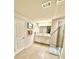 Bathroom featuring tile flooring, double sinks, cabinets, and shower at 776 Woodstock Grove Dr, Woodstock, GA 30188