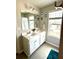 Bathroom featuring double sinks, tile flooring, and natural light at 776 Woodstock Grove Dr, Woodstock, GA 30188