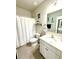 Clean bathroom featuring a vanity, toilet, and shower with curtain at 776 Woodstock Grove Dr, Woodstock, GA 30188