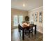 Dining room with a table, chairs, and sliding glass doors at 776 Woodstock Grove Dr, Woodstock, GA 30188