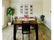 Cozy dining area featuring natural light and decorative accents including artwork, and table decor at 776 Woodstock Grove Dr, Woodstock, GA 30188