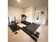 Spacious home gym featuring weights, treadmill, and weight bench for exercise at 776 Woodstock Grove Dr, Woodstock, GA 30188