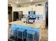 Modern kitchen featuring a large island, granite countertops, stainless steel appliances, and ample cabinet space at 776 Woodstock Grove Dr, Woodstock, GA 30188